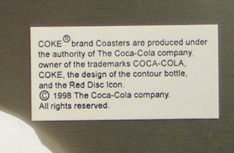 COCA  COLA COASTERS WITH TIN SET OF 4 DATED 1999  