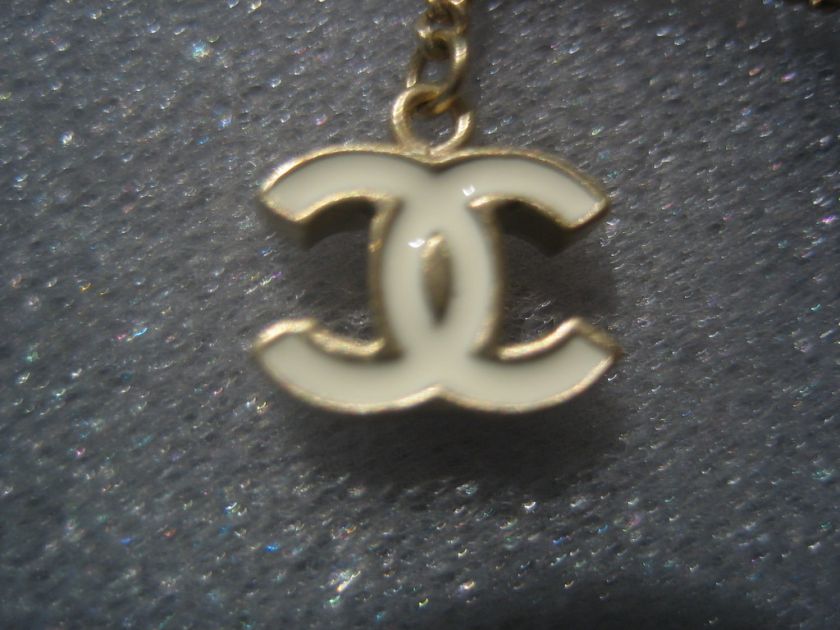   Chanel white CC Logo and Camellia Dangling Charm Earrings  